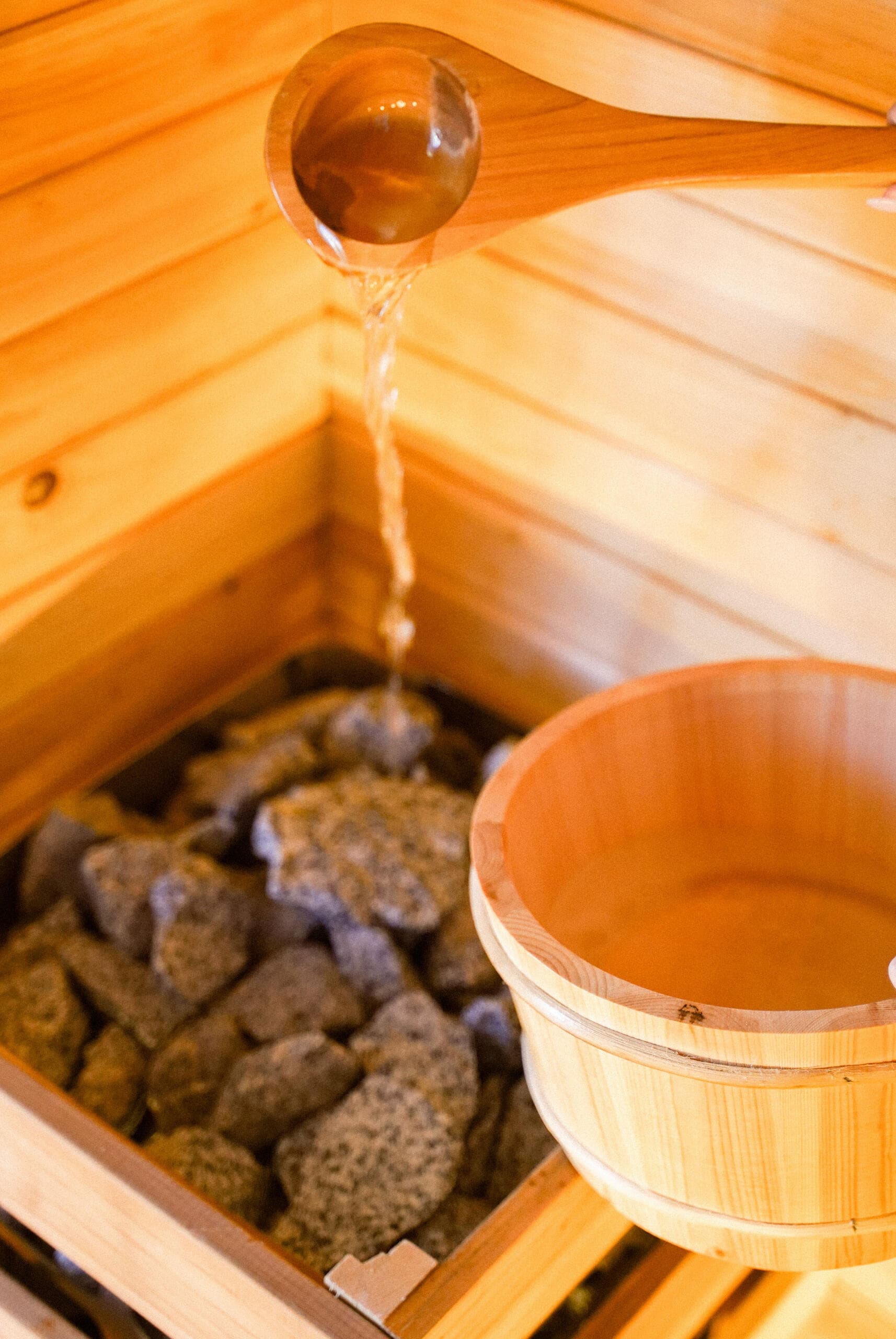 Orijin Restore cedar sauna with Whistler Homecraft stones and wooden ladle